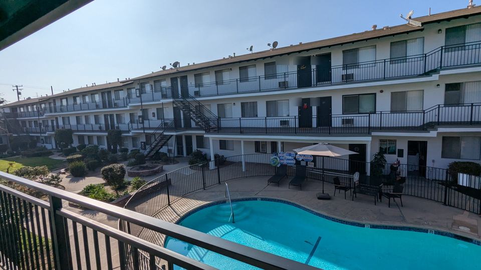 Completed Arcadia apartment courtyard with restored walkways, railings and pool area