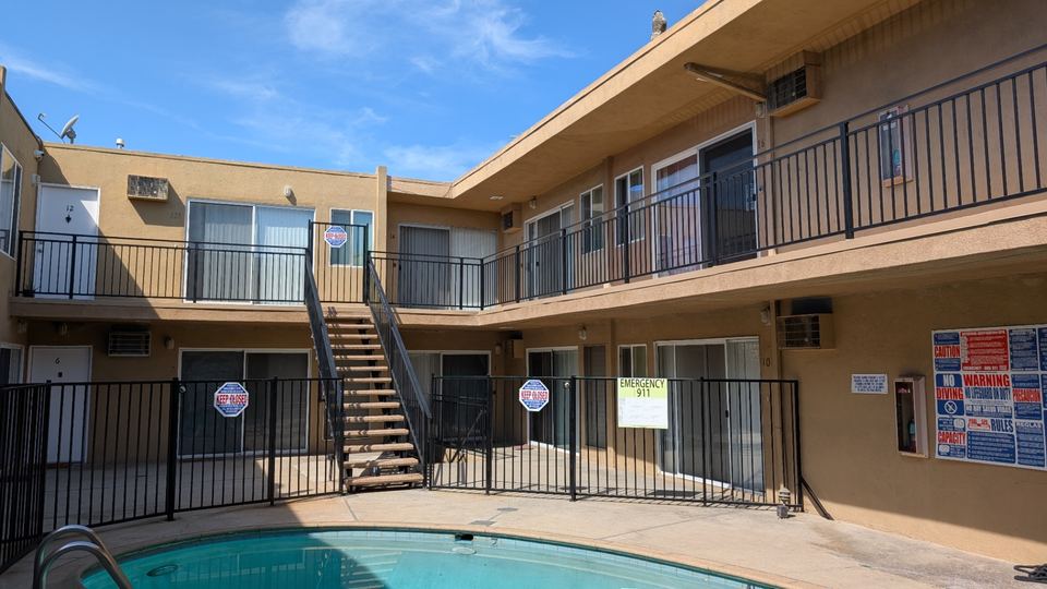 Van Nuys apartment with new railings and walkway repair per SB 721